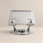 The laptop stand in silver, with hinged arms and a swivel base
